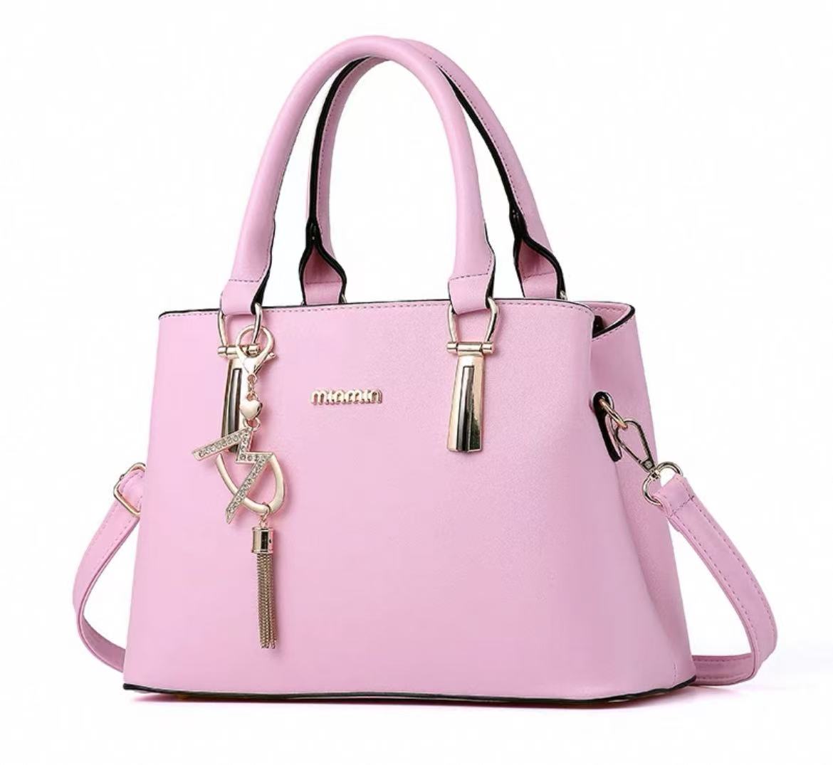 Stylish Handbag with Charm Pendant – Available