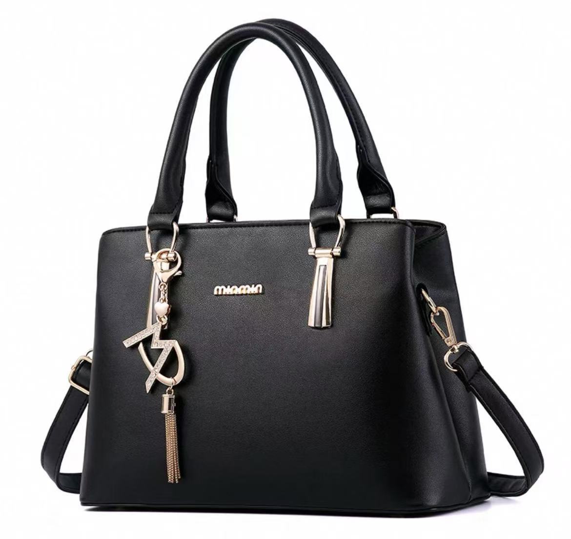 Stylish Handbag with Charm Pendant – Available